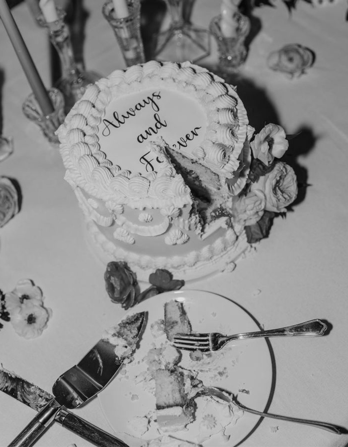 7 Wedding Cake Trends for 2025: Inspiring Designs for Modern Couples 14 Editorial style photo of a vintage-style wedding cake with 'always and forever' spelled on top.