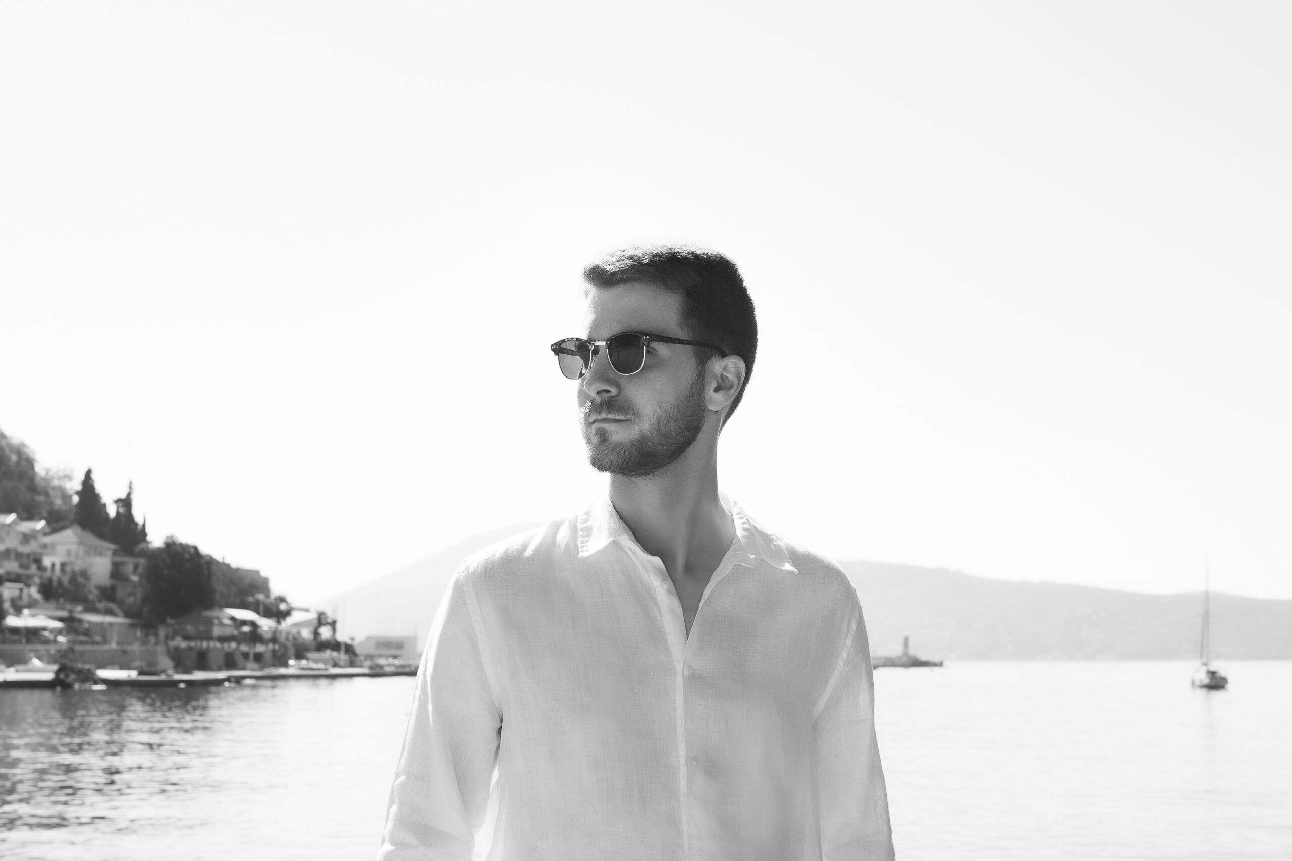 The Magic of a Coastal Ceremony: Editorial Wedding Photography in Herceg Novi, Montenegro 16 Portrait of the groom on his wedding day on a small beach in Herceg Novi
