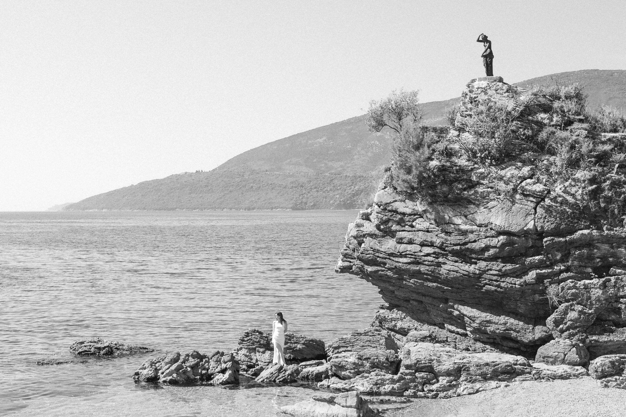 Wedding photoshoot on a small beach in Herceg Novi near famous statue
