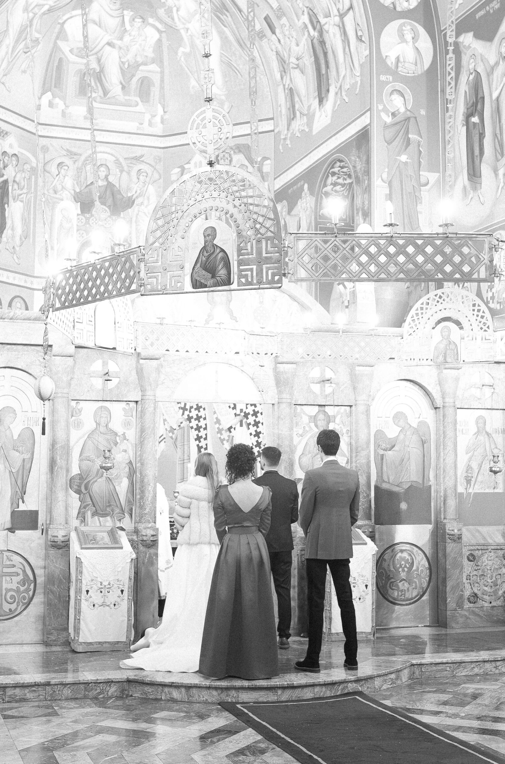 Belgrade Church Wedding at Orthodox Church of St. Luke the Apostle 2 Church wedding in Belgrade, Serbia, captured in the style of analog black and white photography with an artistic touch.
