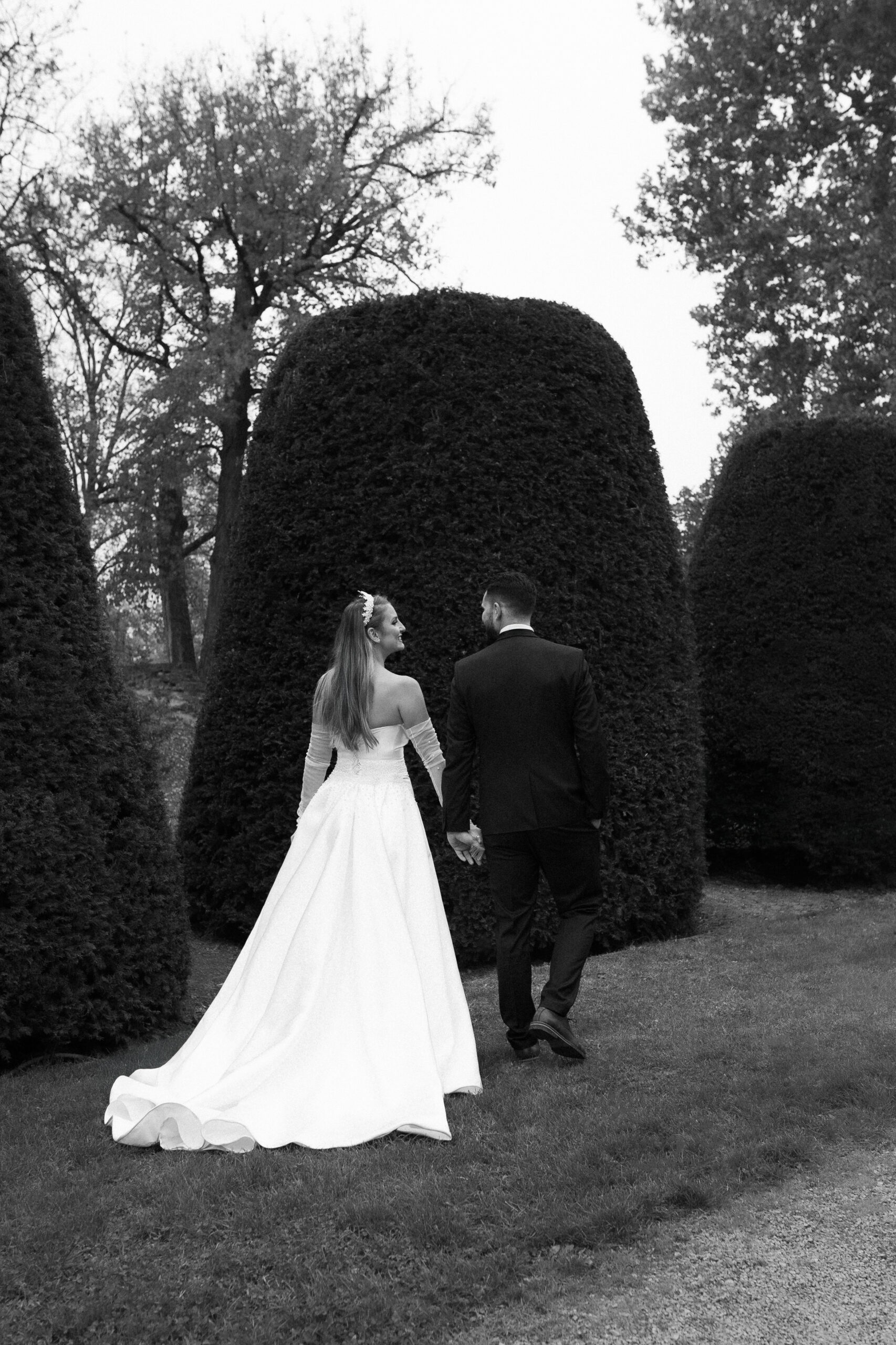 Belgrade Church Wedding at Orthodox Church of St. Luke the Apostle 12 Photo of the bride and groom walking in the garden of Kalemegdan Fortress in Belgrade, Serbia