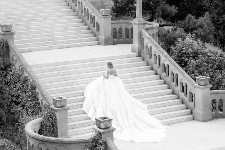 Bride on the Grand staircase of Kalemegdan Fortress in Belgrade, Serbia, photographed in editorial-style in black and white