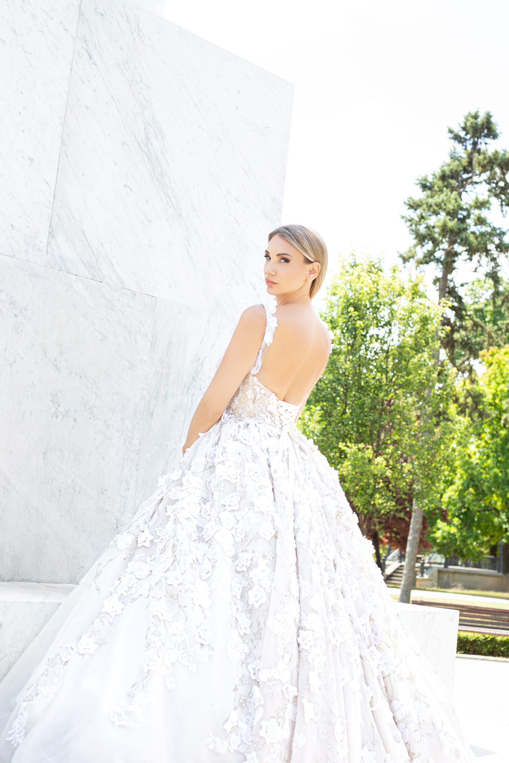 Bride in front of the Monument of Gratitude to France in Belgrade, Serbia, photographed in editorial-style