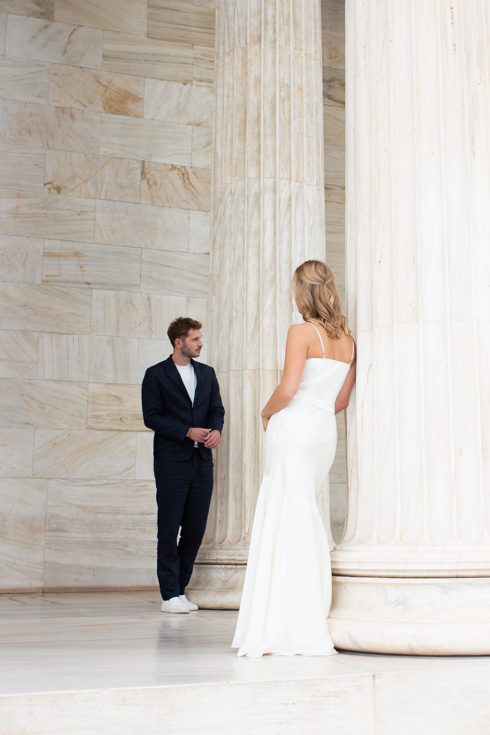 Editorial style photo of bride and groom, captured with artistic composition during a post-wedding photo session in Greece