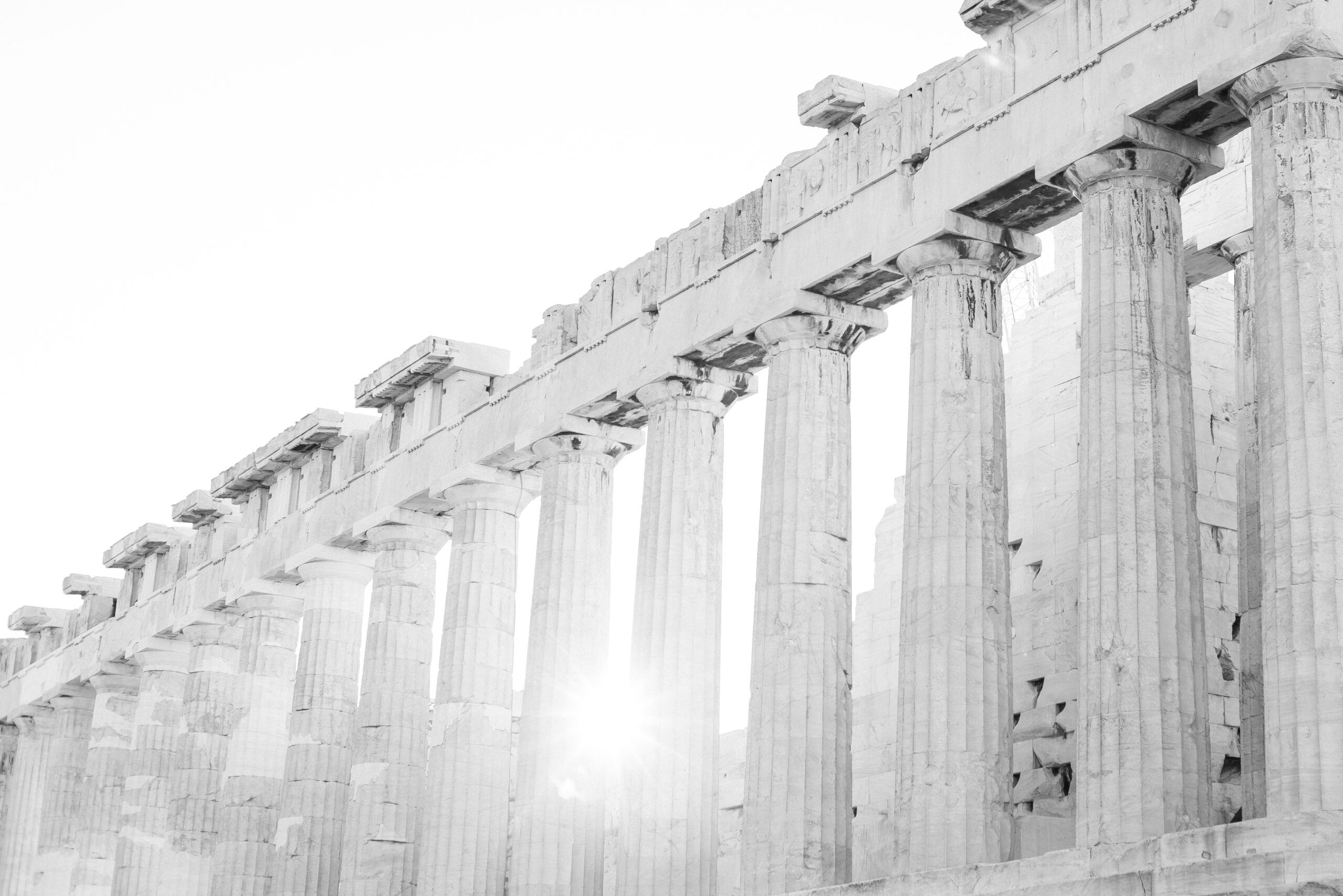 The Acropolis of Athens - sunrise captured between the columns of the Parthenon temple