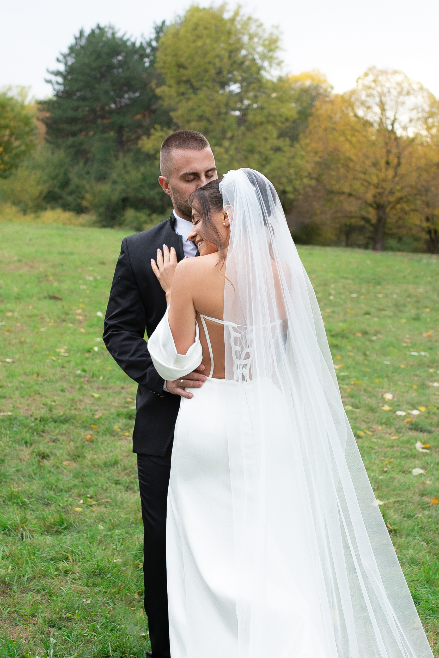 Bride and groom in the gardens of a villa - editorial wedding portrait