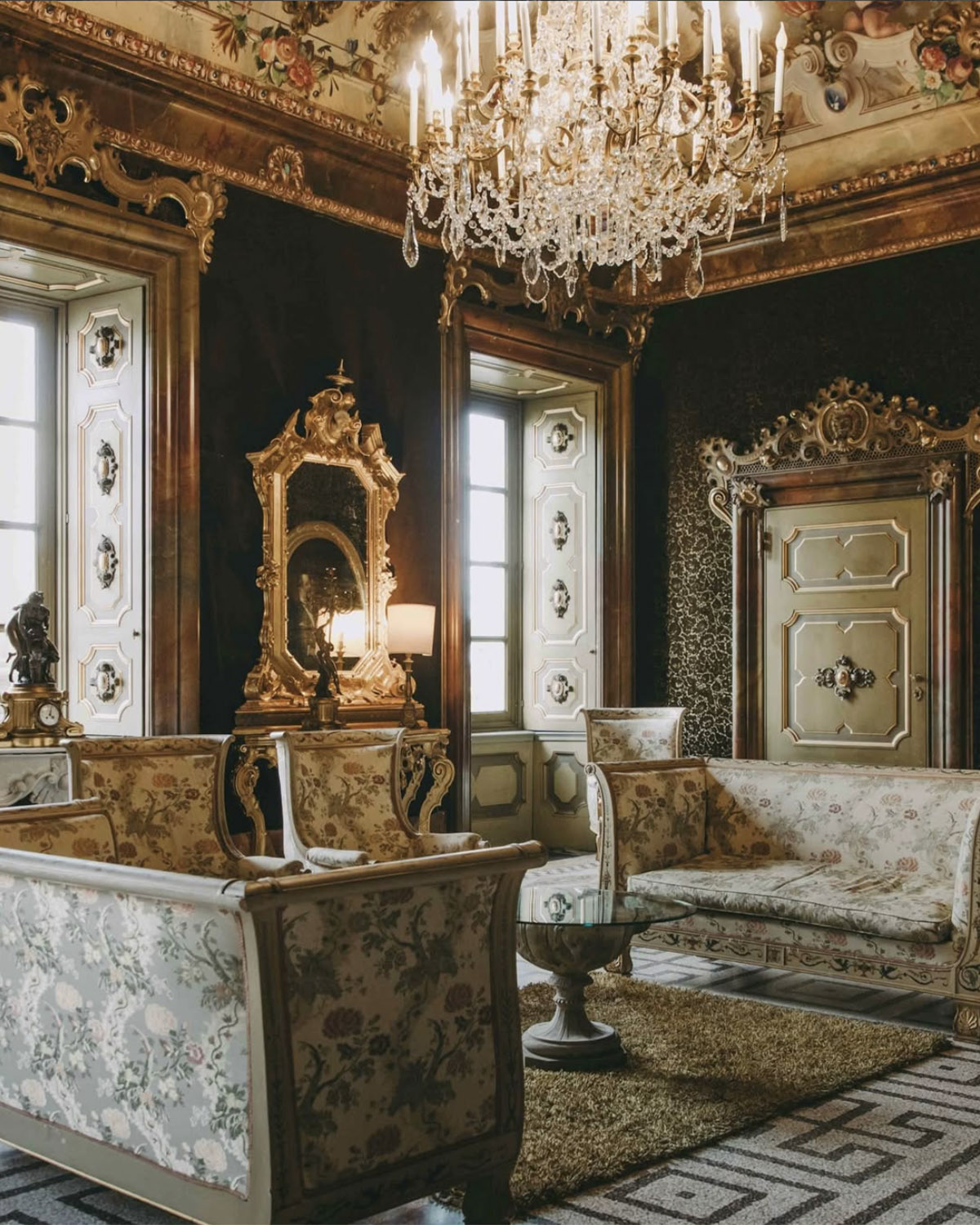 Bergamo, Italy richly decorated salon with gilded mirrors, chandeliers, and vintage furnishings, photographed in a moody, high-end editorial interior style.