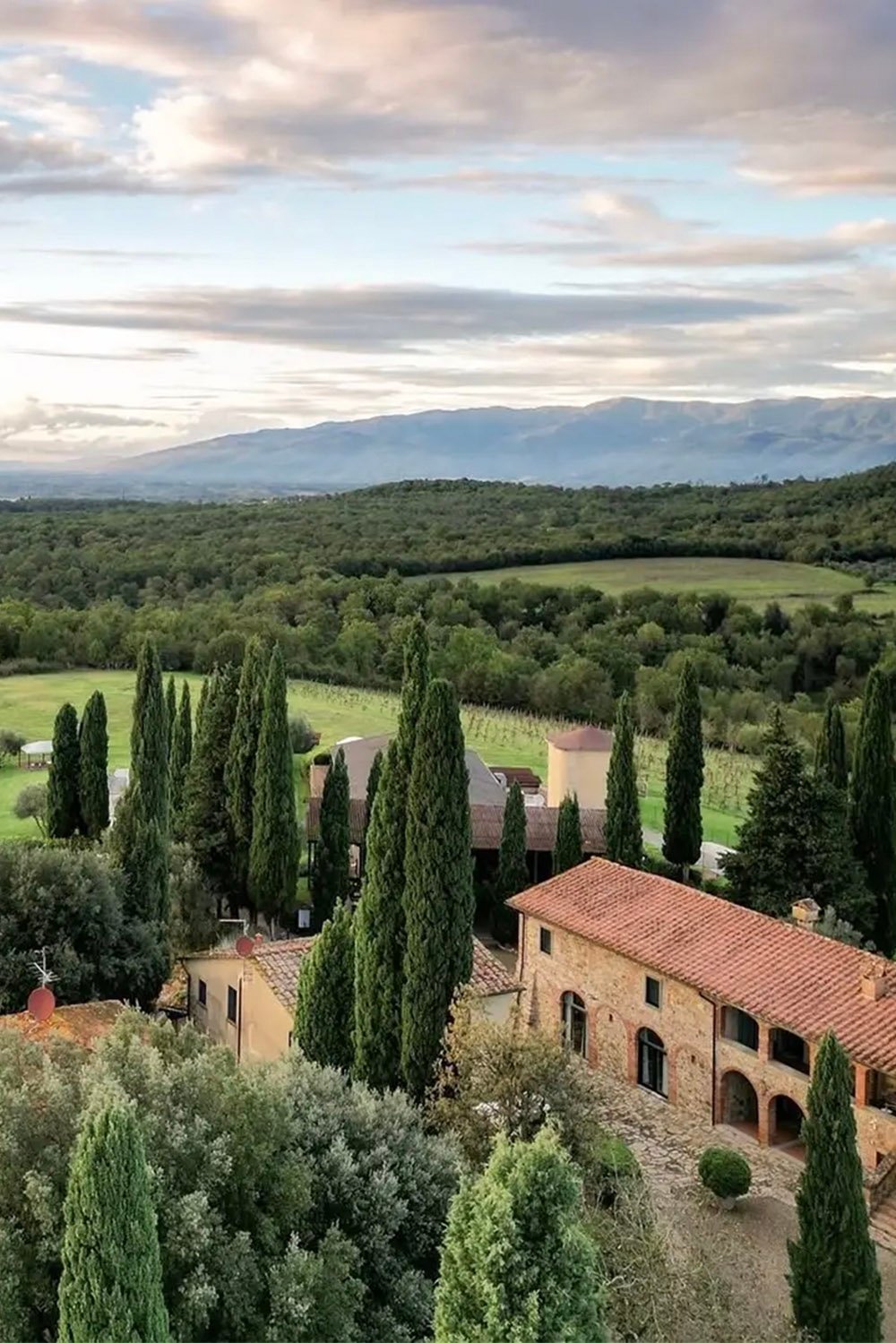 Borgo Iesolana, Tuscany, Italy — a panoramic view of the Tuscan countryside surrounding the historic wedding venue, captured in a timeless editorial style.